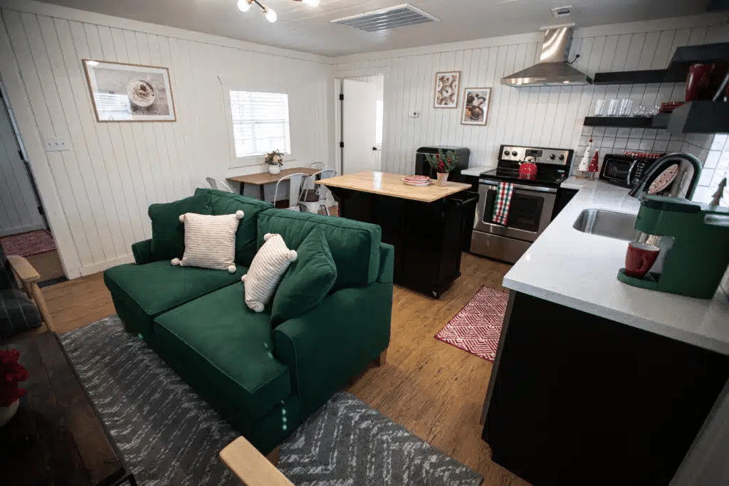 Kitchen and living area of a luxury, glamping-style cabin at Yuletide RV Park off of I-45 in Madisonville, TX. 