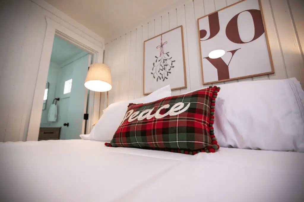 Bedroom of a luxury, glamping-style cabin at Yuletide RV Park off of I-45 in Madisonville, TX. 