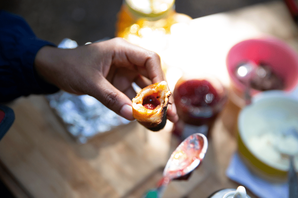 Campfire sweet rolls on a stick, a simple campfire dessert recipe.